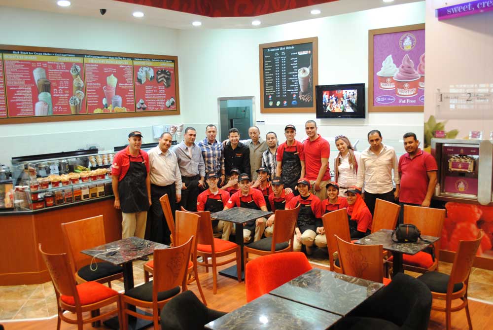 Interior of Cold Stone Creamery and employees in Egypt.